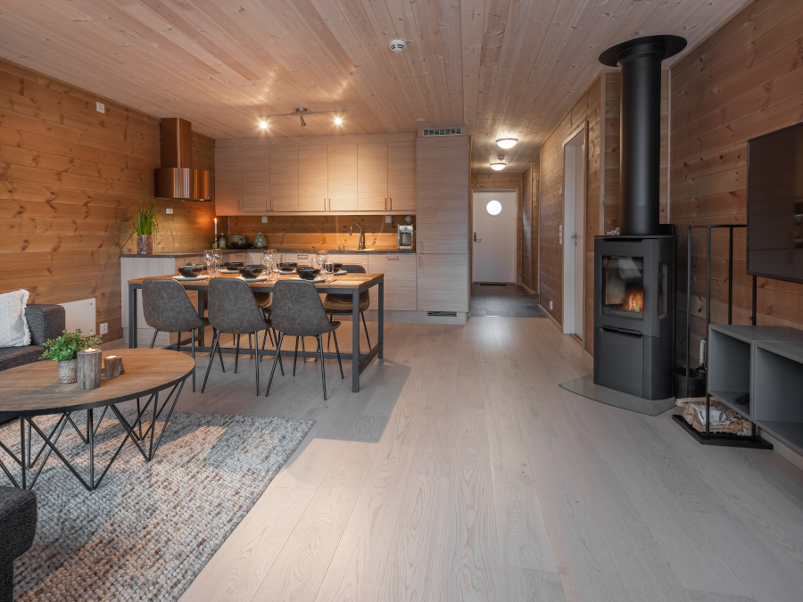 Interior of apartment in Myrkdalen, with fireplace, kitchen and dining table